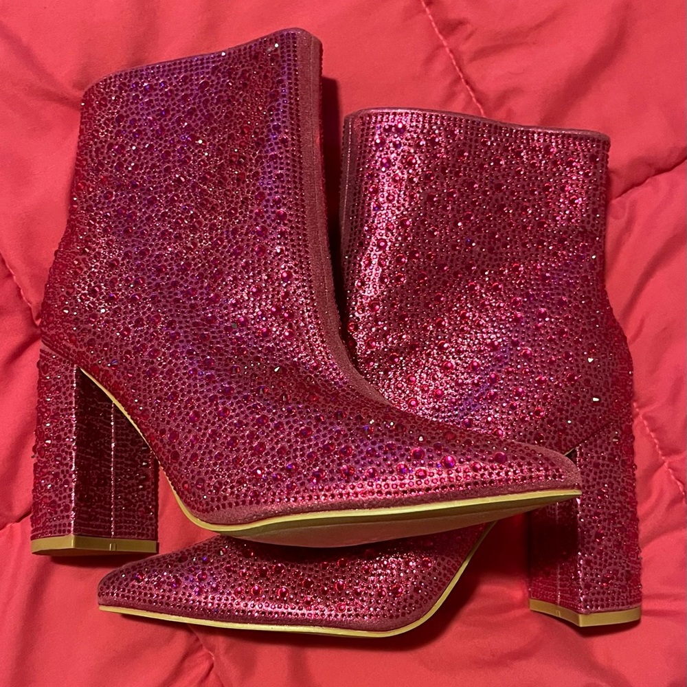 Brand new rhinestone zip up boots. Size 7.